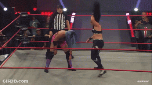 Two Women Are Wrestling In A Ring With A Referee And The Word Impact On The Ring GIF