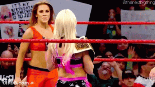 Two Women Are Wrestling In A Ring With A Sign That Says It 'S My Birthday My Only Wish Is To See . GIF