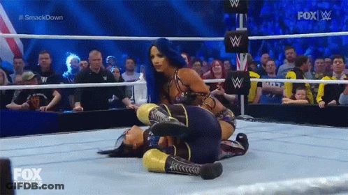 Two Women Are Wrestling In A Wrestling Ring With Fox Deportes On The Screen GIF