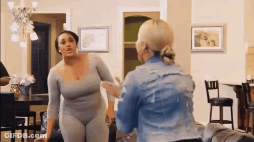 Two Women Arguing In Living Room GIF