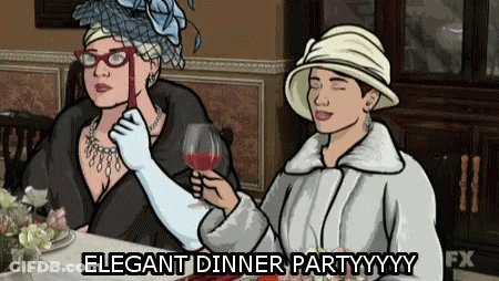 Two Women At Table One Holding Wine Glass Elegant Dinner Partyyyy GIF
