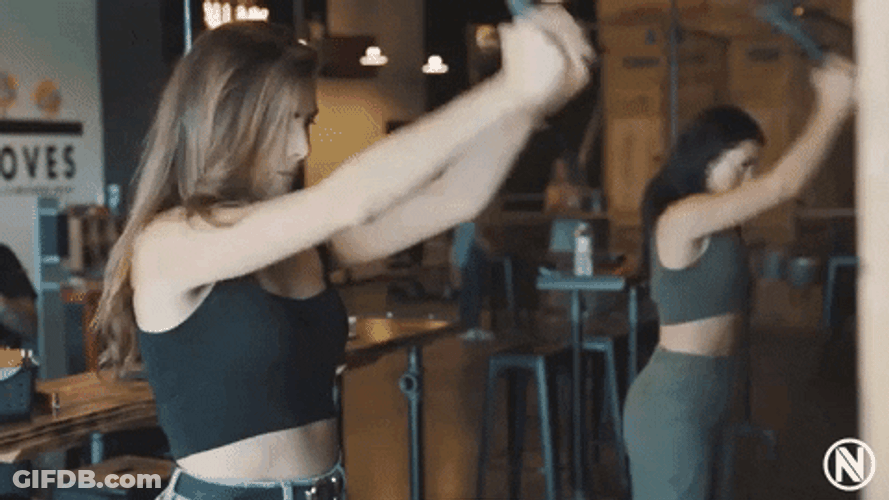 Two Women Axe Throwing GIF