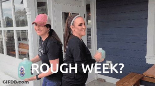 Two Women Carrying Gallons Of Rough Week GIF