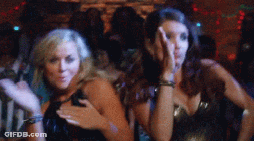 Two Women Dancing In Club One Covering Face GIF