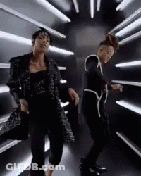 Two Women Dancing In Dark Room GIF