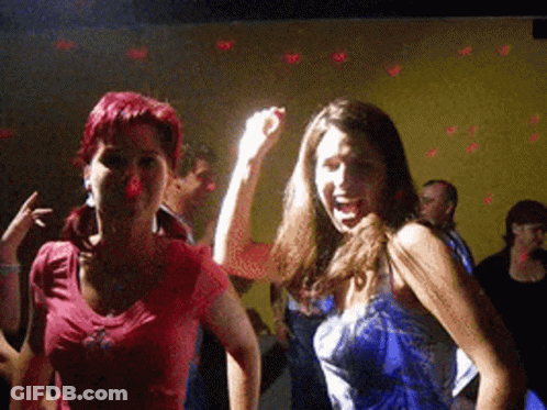 Two Women Dancing In Dark Room One In Blue Dress GIF