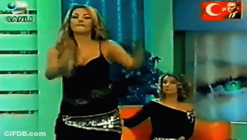 Two Women Dancing In Front Of Canli Logo GIF