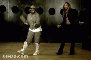 Two Women Dancing In Front Of Hole Wall GIF