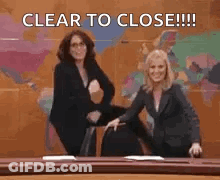 Two Women Dancing In Front Of World Map Saying Clear To Close GIF
