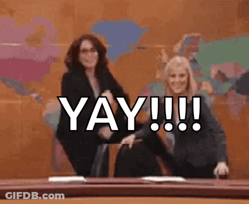Two Women Dancing In Front Of Yay Wall GIF