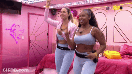 Two Women Dancing In Room With Pink Walls And Beds GIF