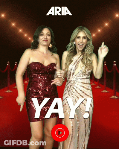 Two Women Dancing On Red Carpet Saying Yay GIF