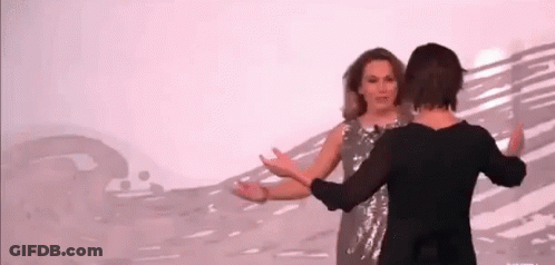 Two Women Dancing On Stage GIF