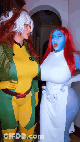 Two Women Dressed As Rogue And Mystique Pose For A Picture GIF