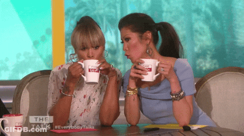 Two Women Drinking From The Talk Mugs GIF