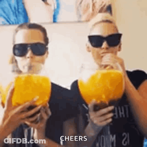 Two Women Drinking Orange Juice GIF