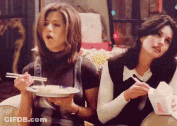 Two Women Eating Food With Chopsticks GIF