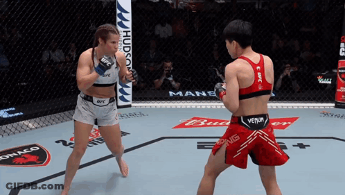 Two Women Fighting In Boxing Ring One In Venum Tank Top GIF