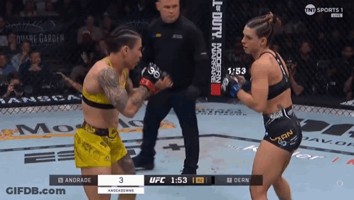 Two Women Fighting In Boxing Ring With Dern Shorts GIF