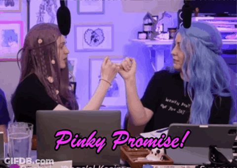 Two Women Giving Each Other A Pinky Promise While Sitting In Front Of Laptops GIF