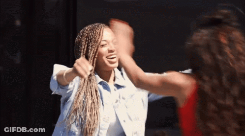 Two Women High Five One With Braids GIF