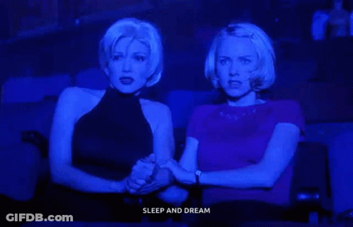 Two Women Holding Hands Watching Movie Sleep And Dream GIF