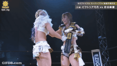 Two Women Hugging Each Other With A Sign That Says #Pw_mg In The Corner GIF