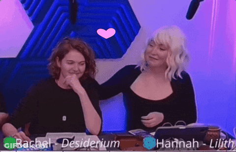 Two Women Hugging Each Other With The Names Rachel Desiderium And Hannah Lilith Visible GIF