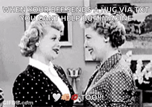 Two Women Hugging In Black And White GIF