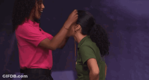 Two Women Hugging In Front Of Evidence Box GIF
