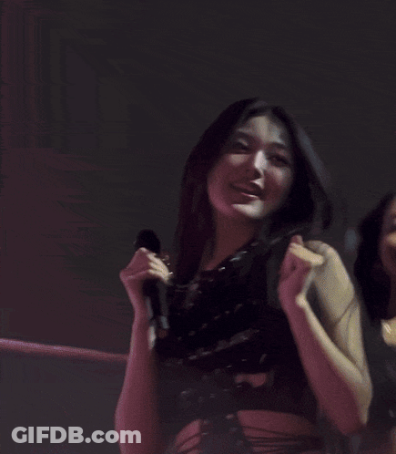 Two Women Hugging On Stage GIF