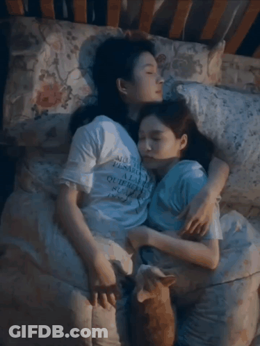 Two Women Hugging One Wearing A La Shirt GIF