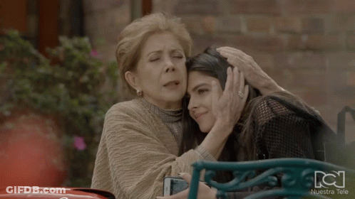 Two Women Hugging With Nuestra Tele GIF