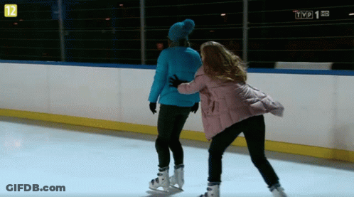 Two Women Ice Skating In Front Of TVP 1 HD GIF