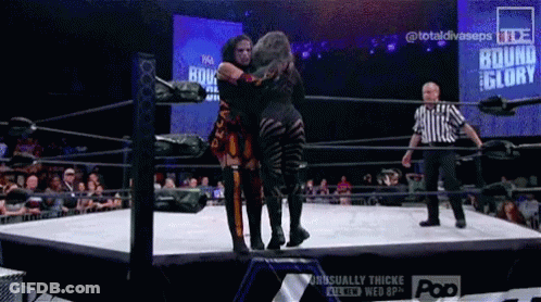 Two Women In A Wrestling Ring With The Words Bound For Glory On The Screen Behind Them GIF