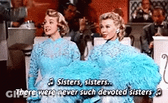 Two Women In Blue Dresses Singing Sisters GIF