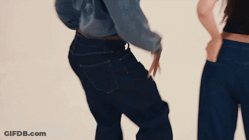 Two Women In Blue Jeans Hands In Pockets GIF