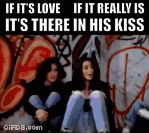 Two Women In Front Of Graffiti Wall Saying If It's Love GIF