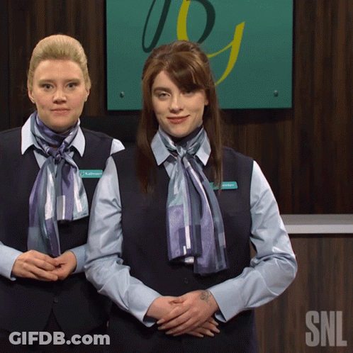 Two Women In Front Of SNL Sign GIF