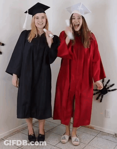 Two Women In Graduation Gowns With Diploma GIF