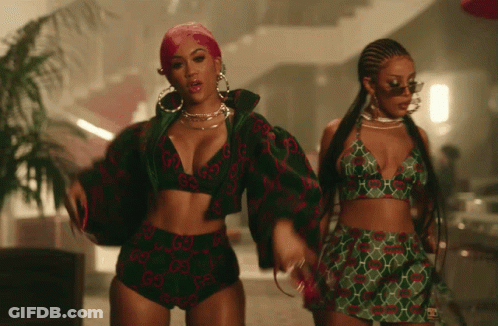 Two Women In Gucci Outfits GIF