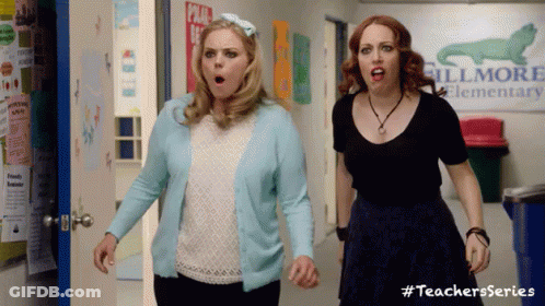 Two Women In Hallway With Fillmore Elementary Sign GIF