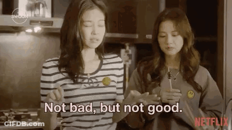 Two Women In Kitchen One Holding Lollipop GIF