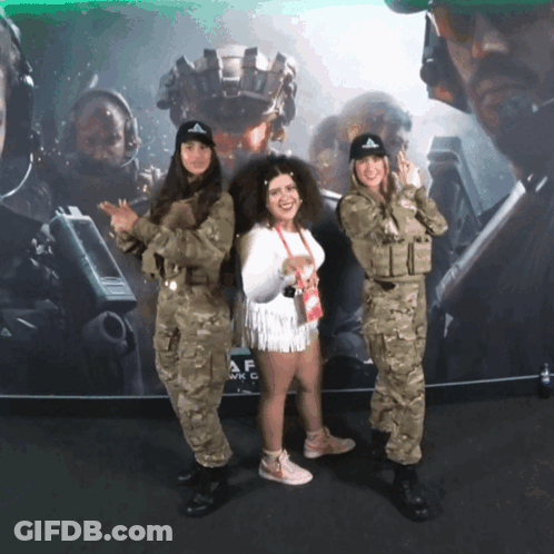 Two Women In Military Uniforms Posing GIF