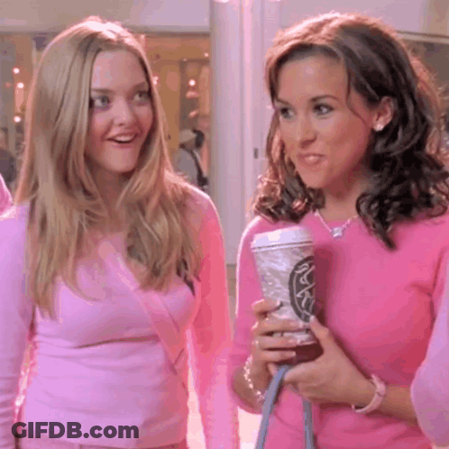 Two Women In Pink Sweaters One Holding Starbucks Coffee GIF