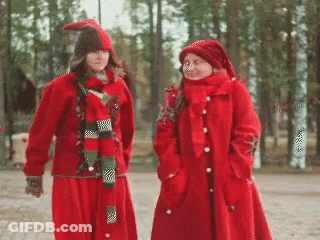 Two Women In Red Clothes And Hats GIF