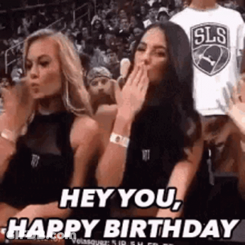 Two Women In Stands One Covering Mouth GIF