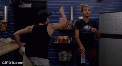 Two Women In Store One Holding Water Bottle GIF