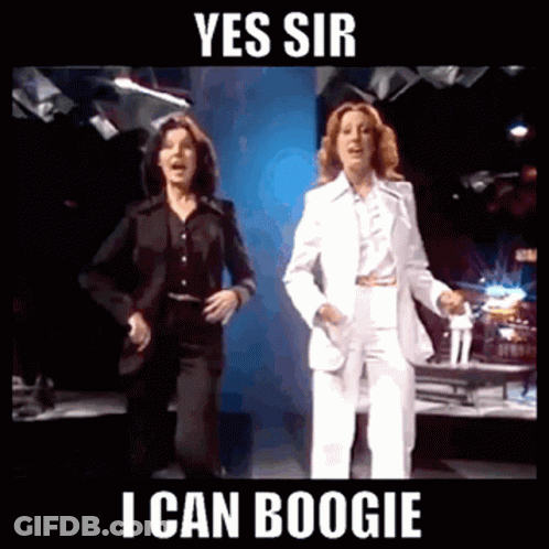 Two Women In Suits Are Dancing With The Words Yes Sir I Can Boogie GIF