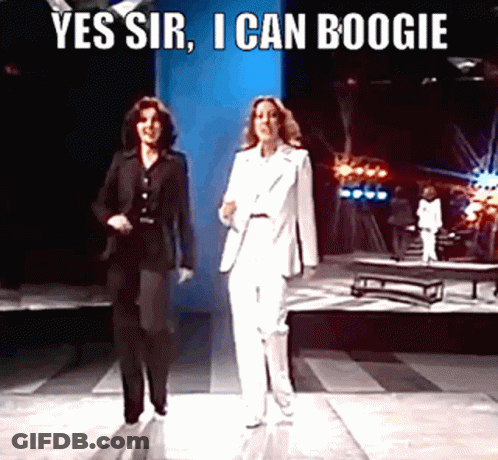 Two Women In Suits Walking On Stage Yes Sir I Can Boogie GIF